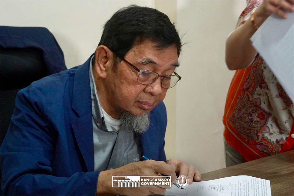 Minister of Labor and Employment (MOLE) Datu Muslimin Sema signs the Memorandum of Agreement for minimum wage increase in the Bangsamoro Autonomous Region in Muslim Mindanao on February 7, 2024, inside the Bangsamoro Government Center, Cotabato City. (Photo courtesy of Marhom Ibrahim/BIO)