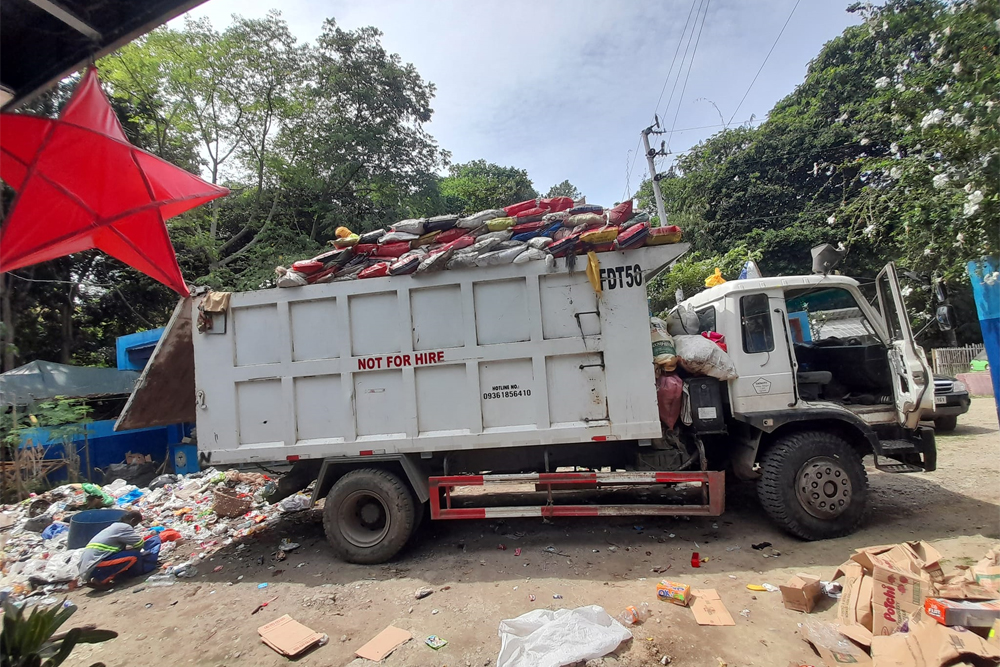 A dump truck unloading garbage from a service-contractor at Tablon material recovery facility area in Cagayan de Oro City. [Photo courtesy of Clenro Cagayan de Oro]