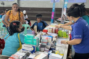 Watsons Alagang Pangkalusugan Medical Mission beneficiaries line up for free medicine and vitamins