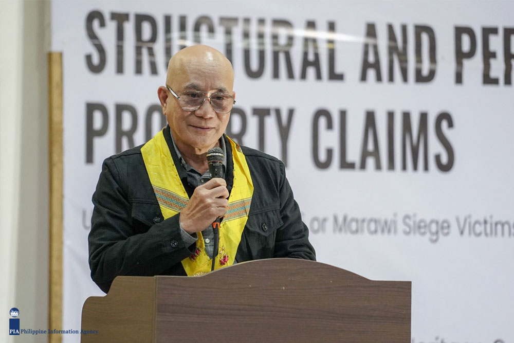 Retired Major General Melquiades Feliciano delivered the message of Sec. Carlito Galvez Jr. during the ceremonial awarding of structural claims spearheaded by the Marawi Compensation Board on April 17, 2024 at the Meranaw Cultural Heritage Center, MSU Marawi. (Photo by: DCC/PIA-10)