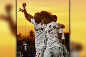ENJOY THE MATCH AND THE SUNSET. Cebu Football Club Senegalese striker Abou Mouhamed Sy raises his hand of victory after scoring from the spot in their match against Loyola FC in the Philippine Football League (PFL) opening match at the Dynamic Herb/Borromeo stadium at the South Reclamation Project, Talisay City. Cebu FC wins 4-0. With him is reliable defender Goktug Demirodlu. (Photo by Robert ‘Kid’ Nicart)