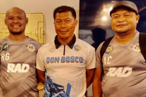 REUNITED. The Spirit of 1996 Go-For-Goal Champion lives one as three members of that champion team Salazar Institute of Technology-Don Bosco Boys Home (SIT-DBBH) Glenn Ramos (center) Rocky Garciano, (left) and Archival Commendador are part of the CVRFA-DBTC coaching staff that has advanced to the semis in the PFF Men’s National U19 Championship at the Rizal Memorial stadium on June 7. (Contributed photo)